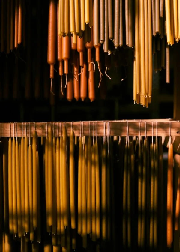 Beeswax dinner candles in copper holders
